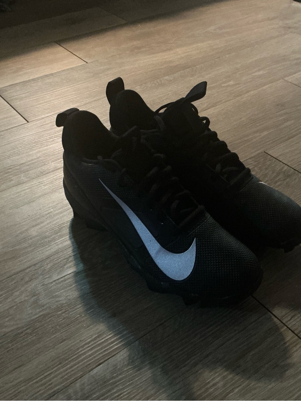 Nike Men's Black Athletic Sneakers with Reflective White Swoosh